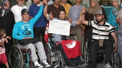 عدد من جرحى الثورة يحاولون الانتحار شنقا امام التأسيسي 