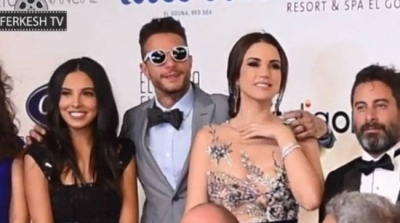 شاهد رد فعل درة تجاه أحمد الفيشاوي بعدما وضع يده على كتفها (فيديو)